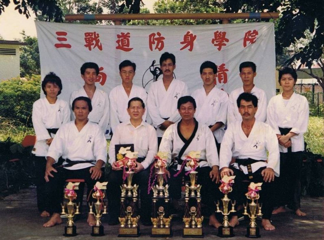Champions with trophies